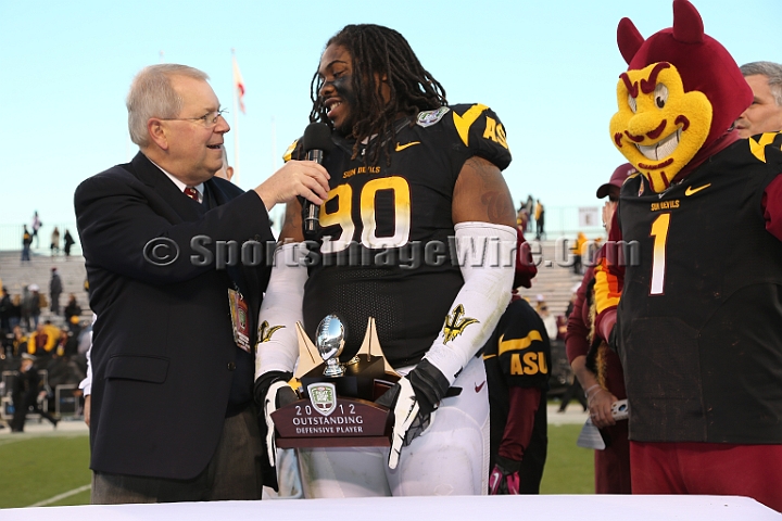 122912 Kraft SA-063.JPG - Dec 29, 2012; San Francisco, CA, USA; Arizona State Sun Devils defensive tackle Will Sutton (90) is presented the defensive outstanding player award by  Kraft Fight Hunger Bowl executive director Gary Cavalli, against the Navy Midshipmen in the 2012 Kraft Fighting Hunger Bowl at AT&T Park.